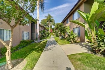 Walkway with lush landscaping at idylwood apartments